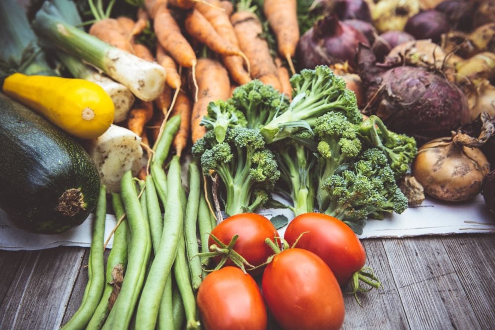 photograph of vegetables like tomatoes, broccoli and green beans